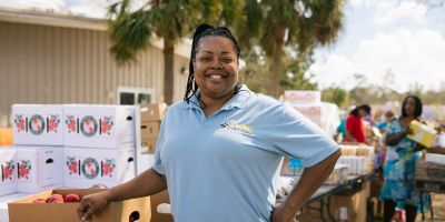 A food bank worker at a food distribution location.